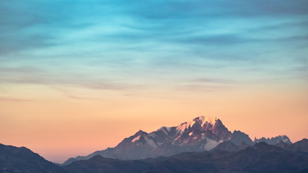 a mountain range with a blue sky