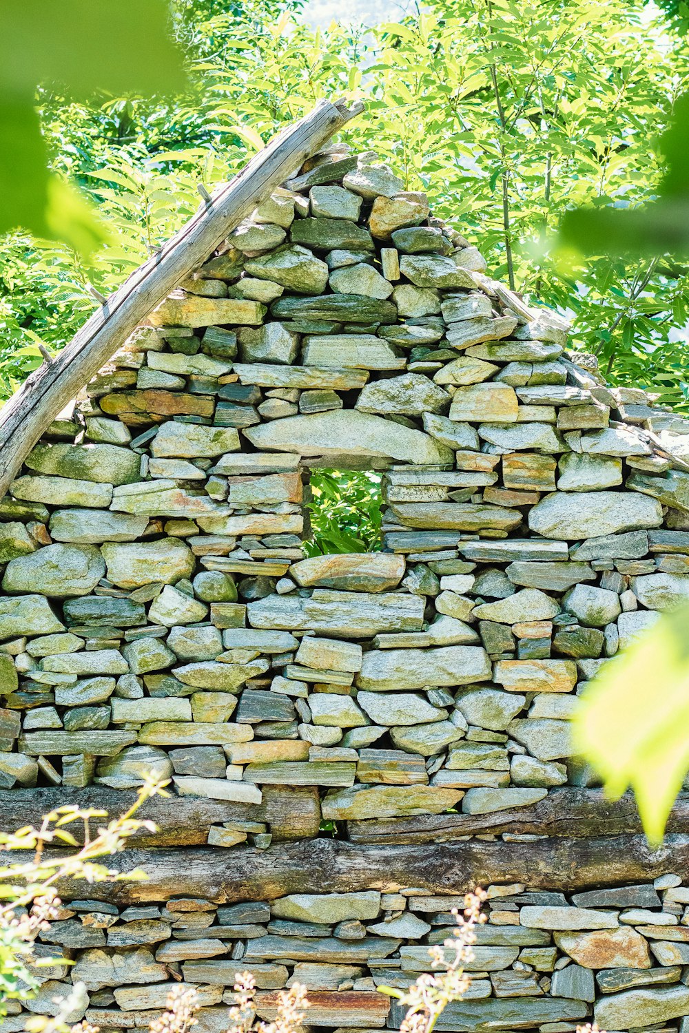 a stone wall with a stone walkway