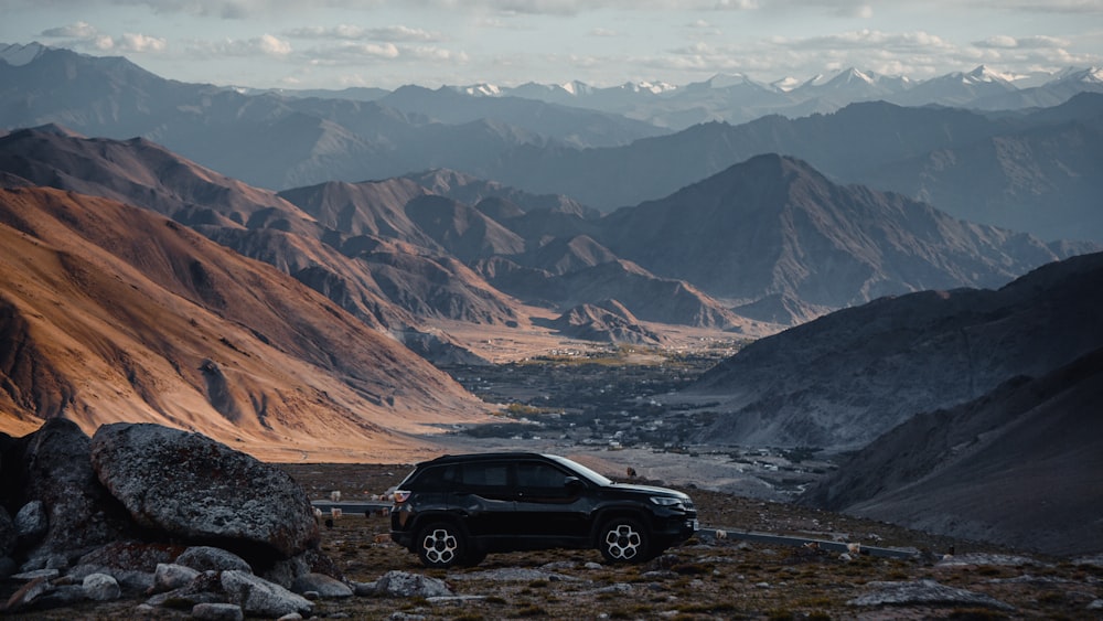 a car parked on a rocky hill