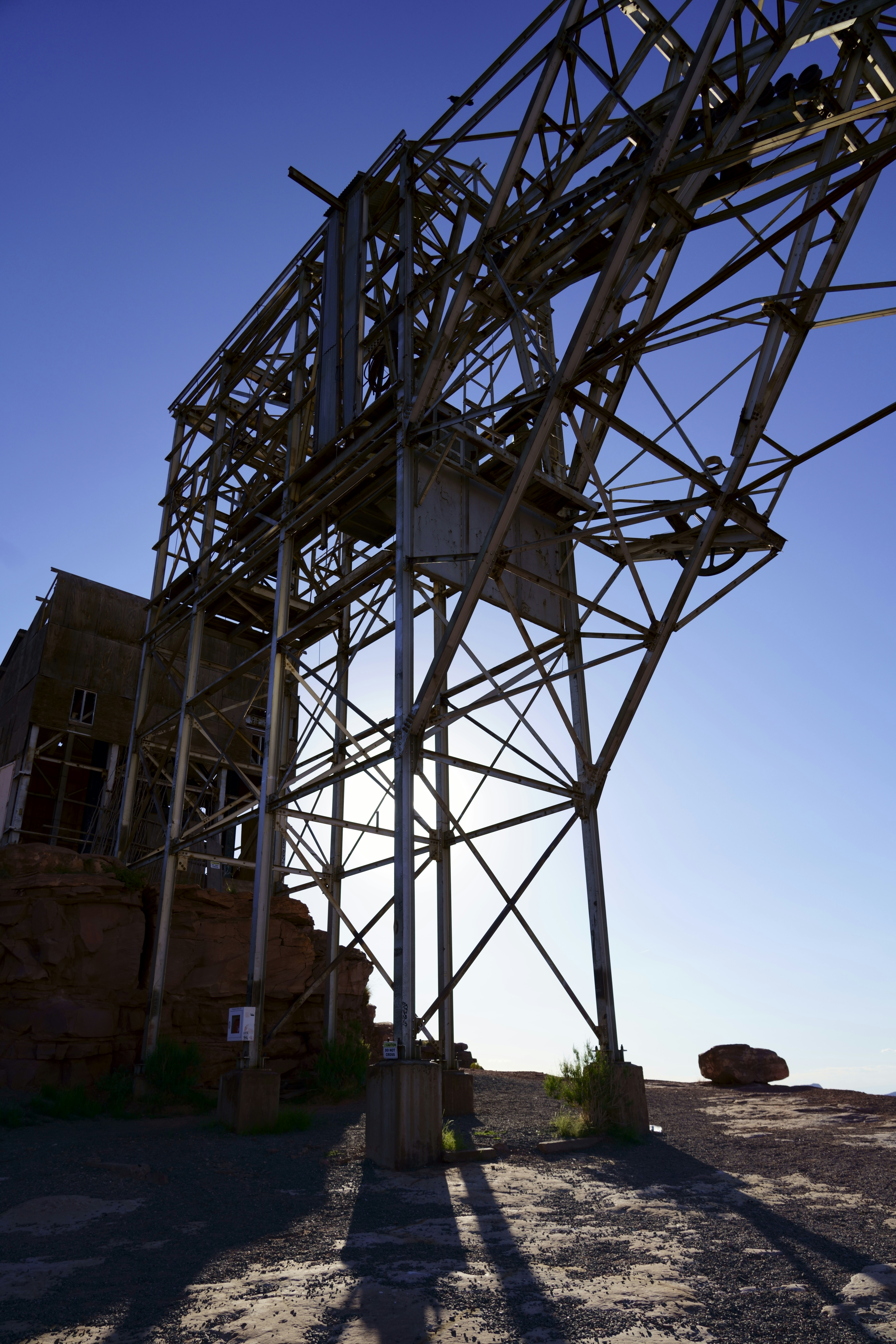 Industrial steel structure with dramatic orange sunset sky