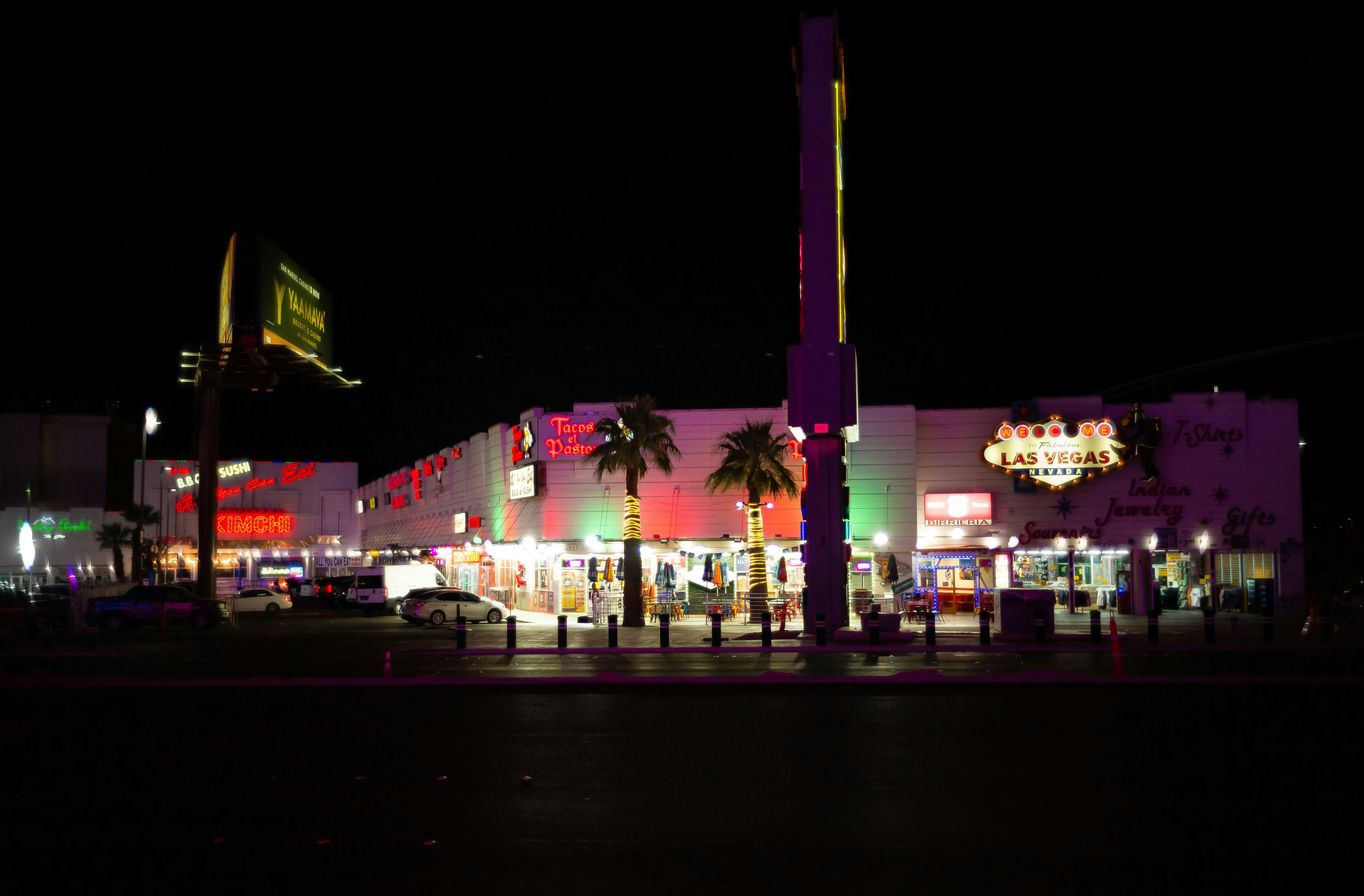 a building with a tower in the middle at night