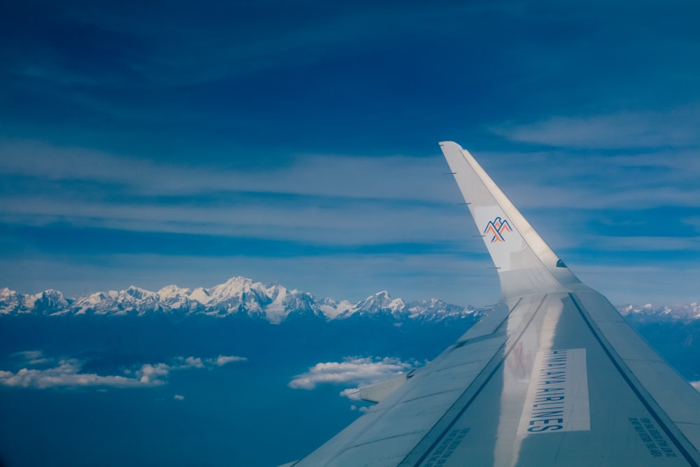 an airplane wing in the sky