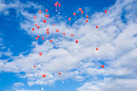 a group of balloons in the sky