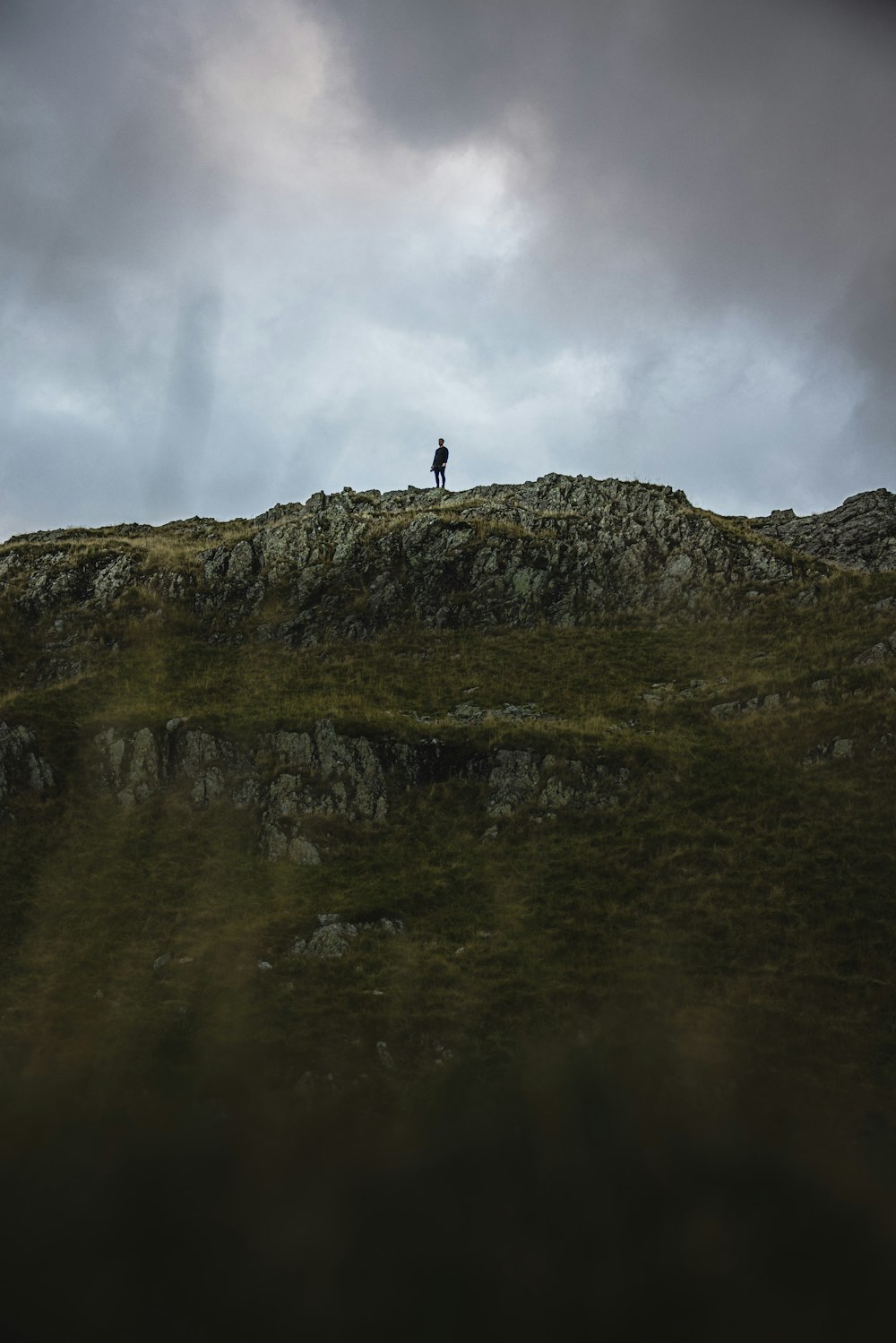 a person standing on a cliff