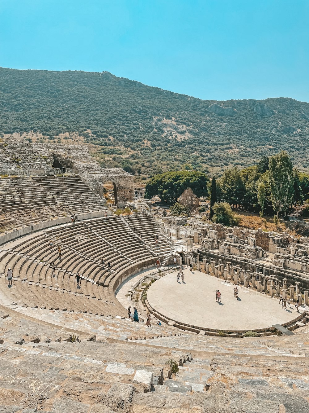 a large circular structure with people standing around it