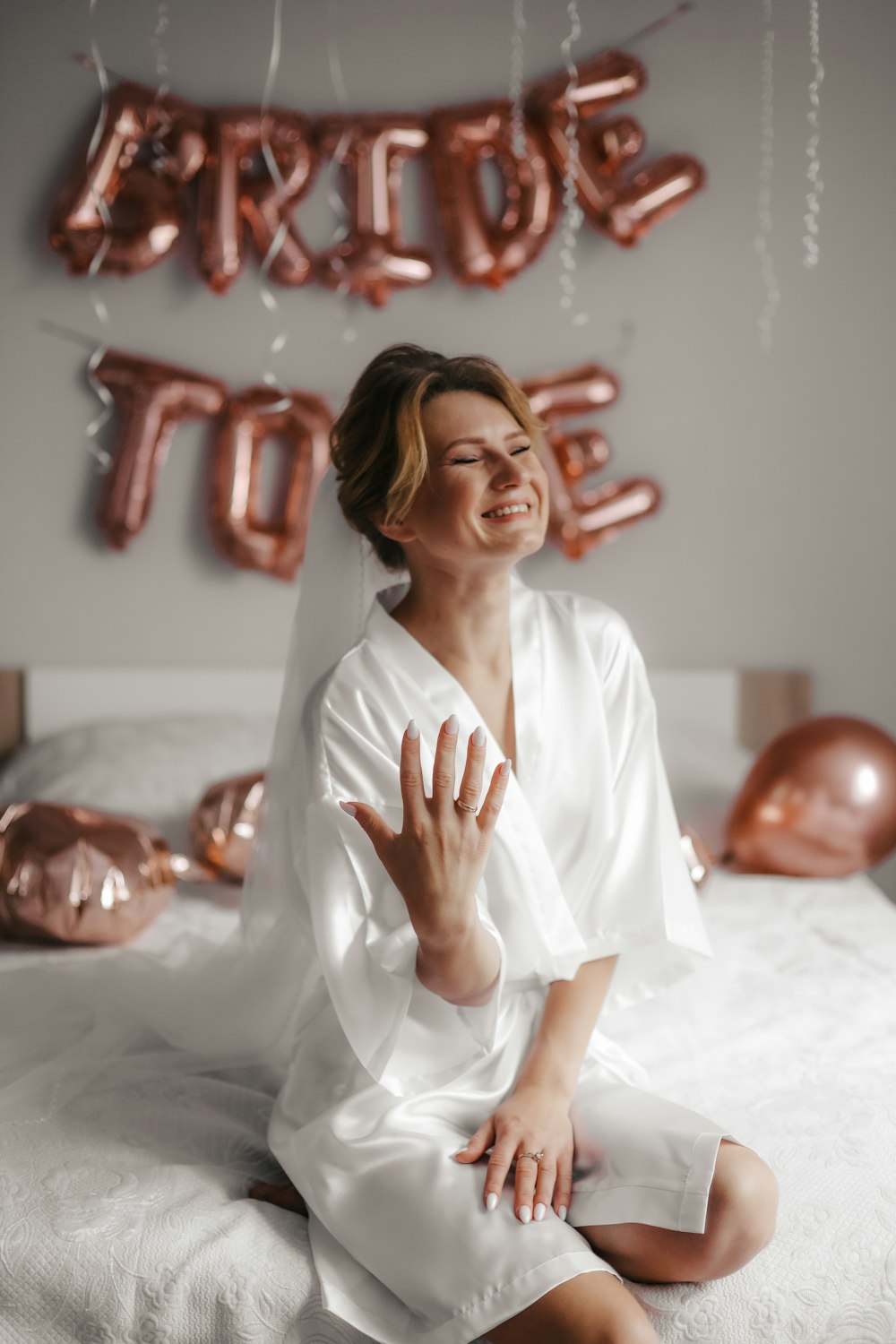 a woman sitting on a bed