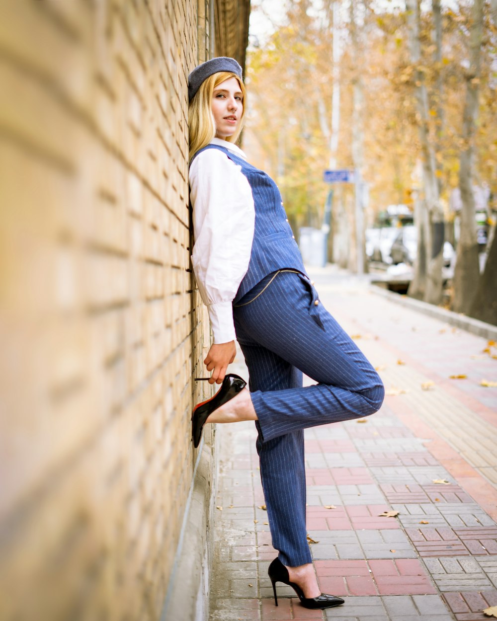 a person leaning against a wall