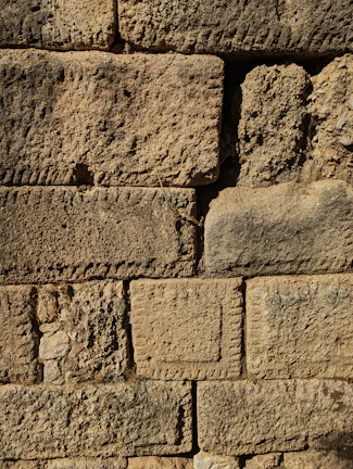Close-up of ancient stone bricks showing the detailed craftsmanship of the Great Wall.