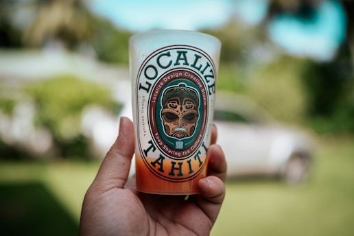 a hand holding a can
