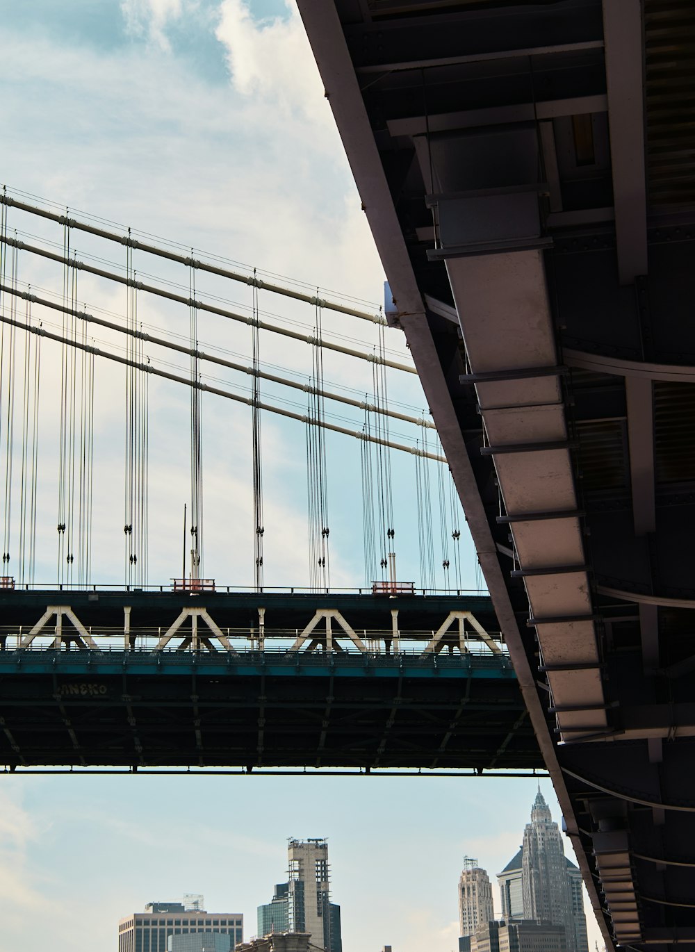 a bridge with a city in the background