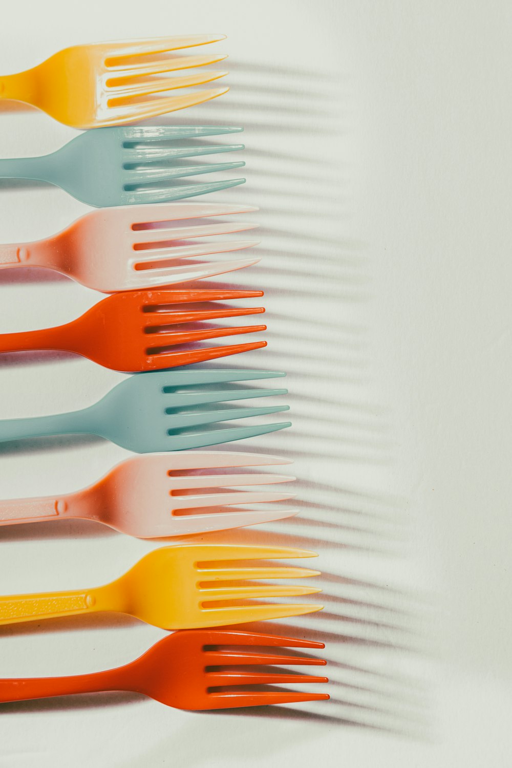 a group of orange scissors