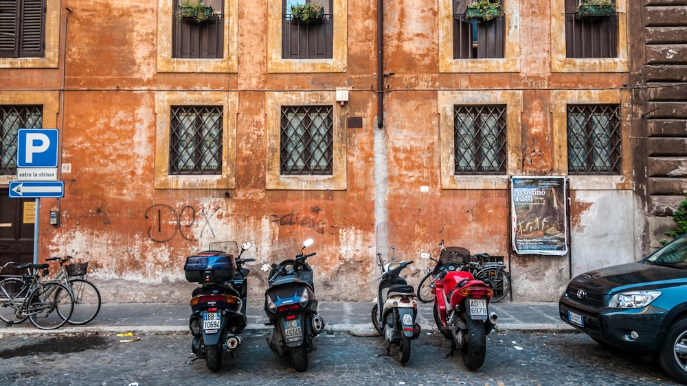 motorcycles parked on the side of a street