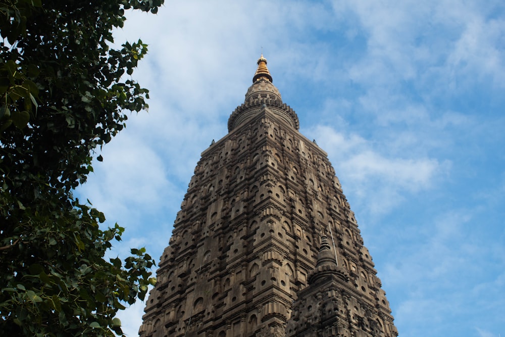 a tall building with a gold top