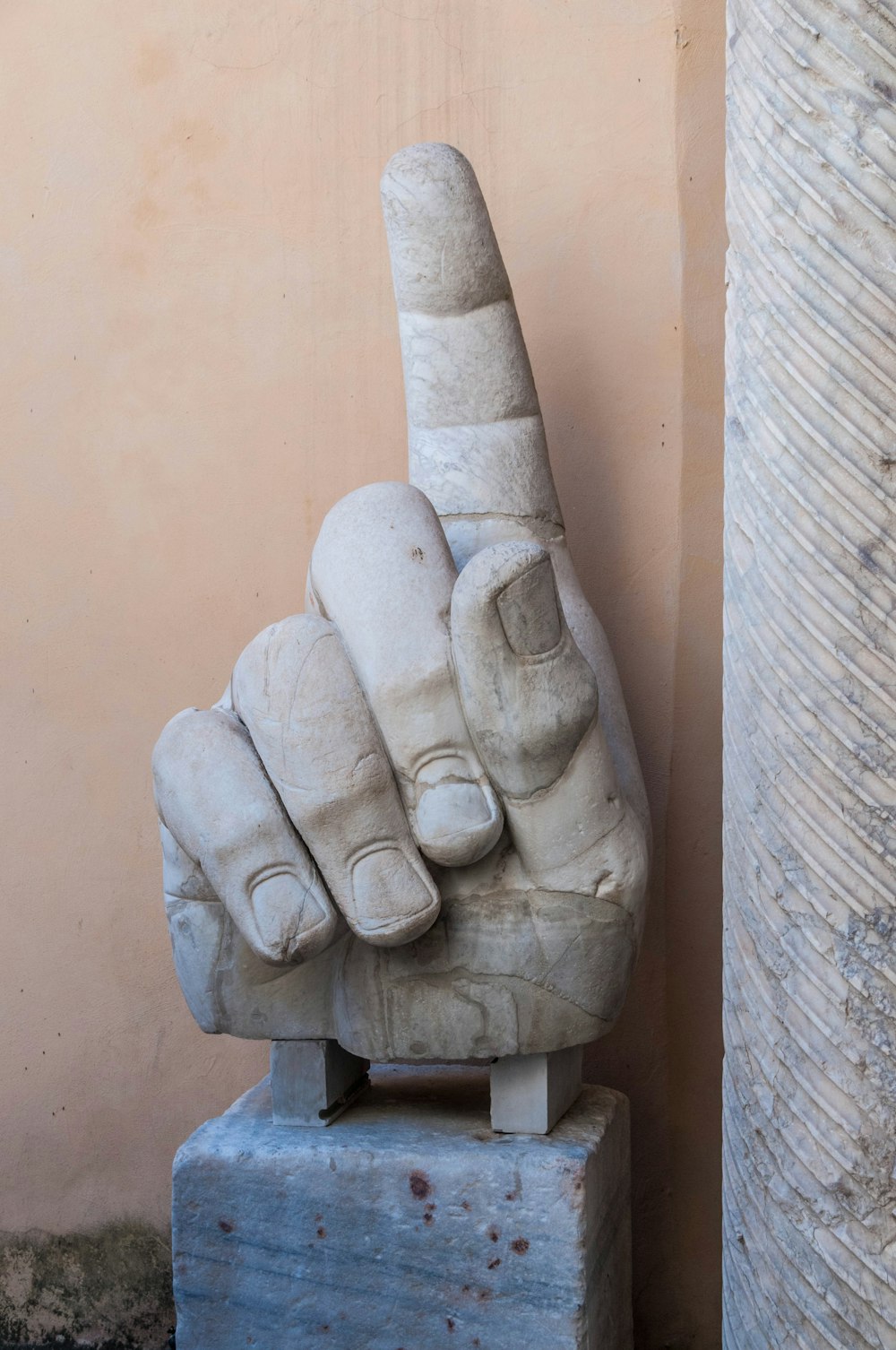 a stone sculpture of a man and a woman