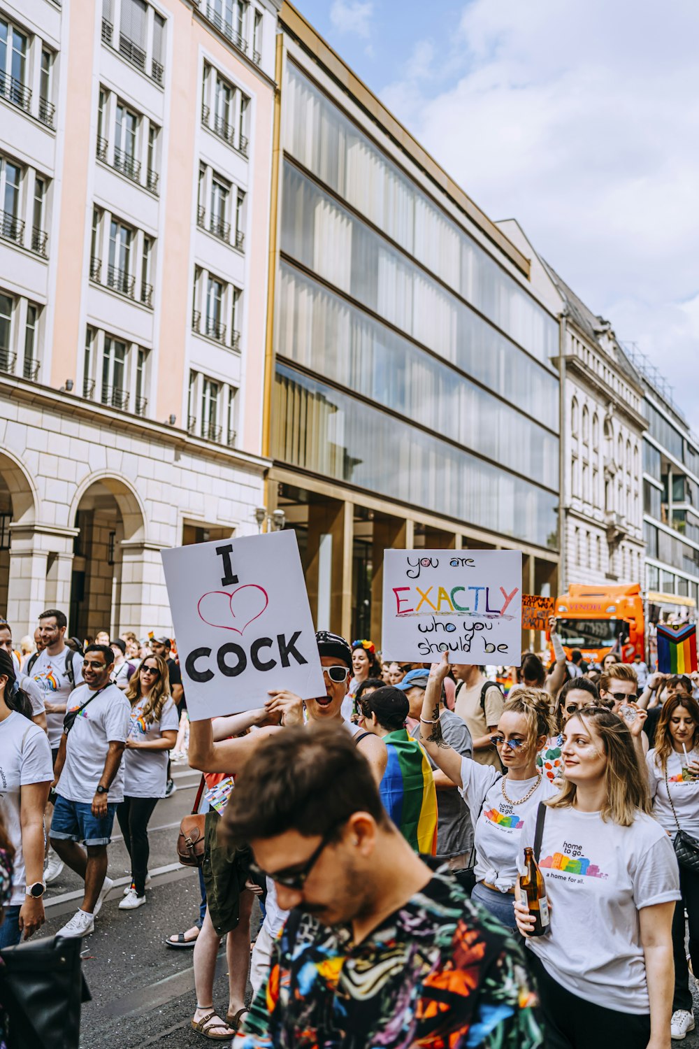 a crowd of people marching in a street