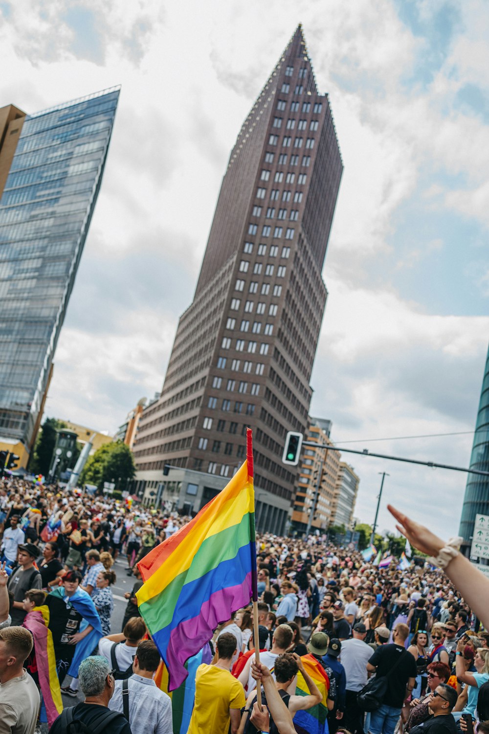 a crowd of people in front of a tall building