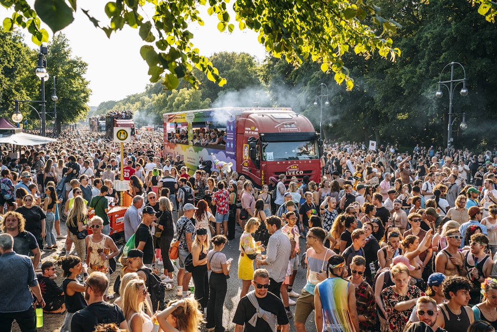 a large crowd of people watching a parade