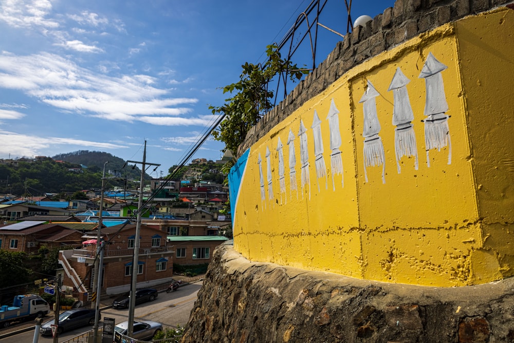 a yellow building with a blue sky