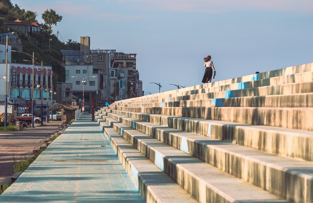 a person standing on a bridge