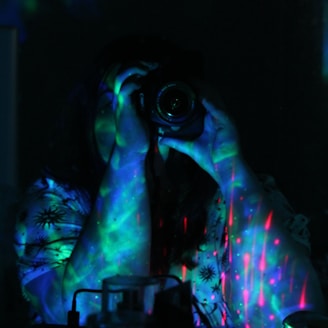 a person taking a picture with a camera