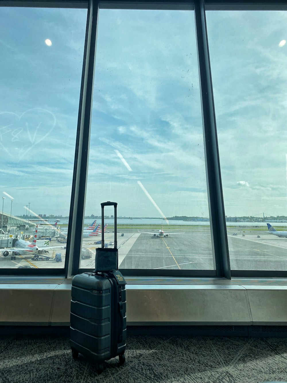 a suitcase sits on a window sill