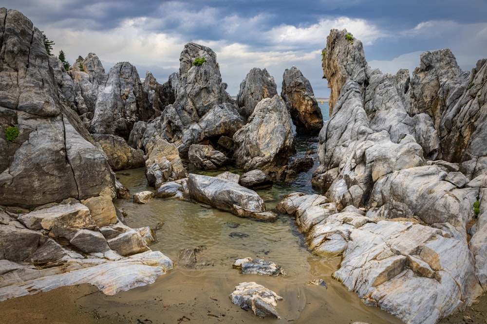 a rocky river with a large amount of water flowing through it