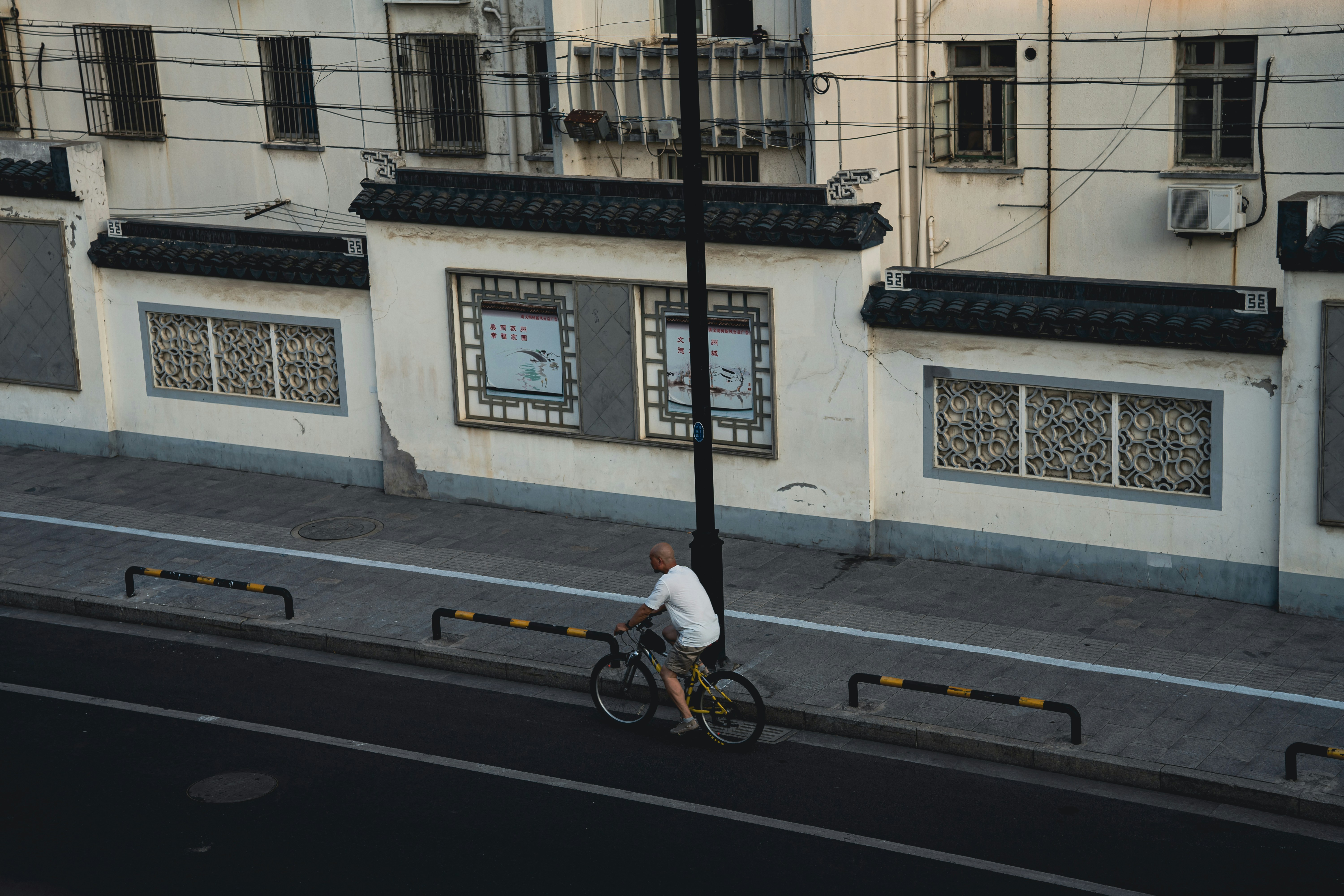 a person riding a bicycle on a street
