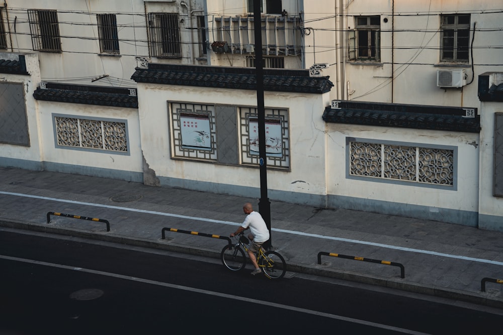 a person riding a bicycle on a street