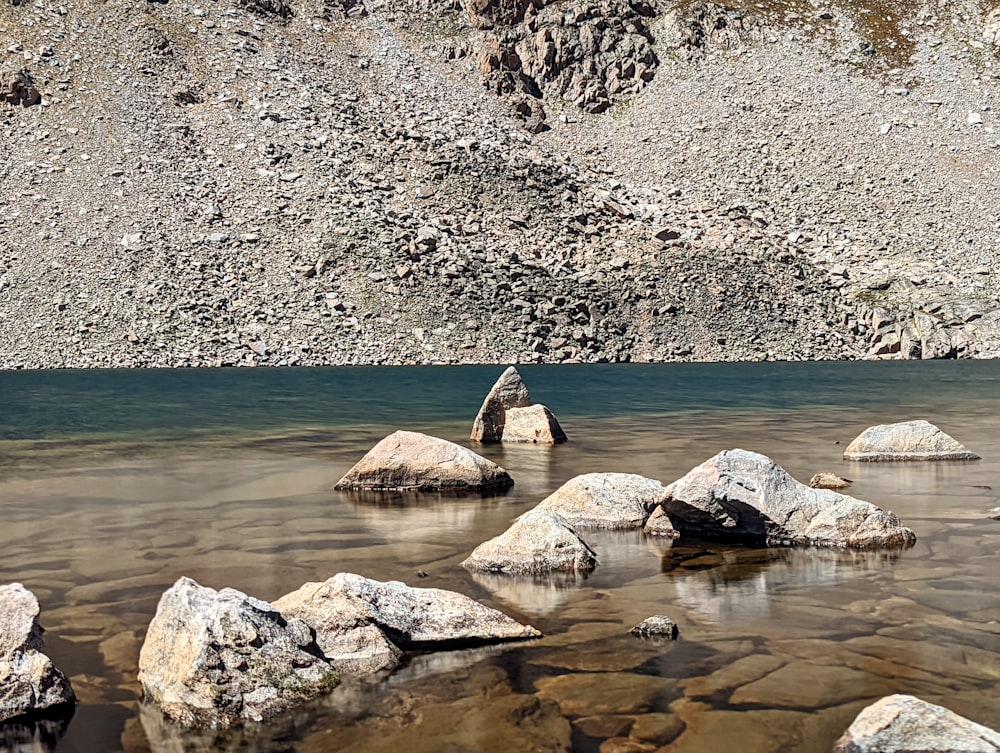 a group of rocks in a body of water