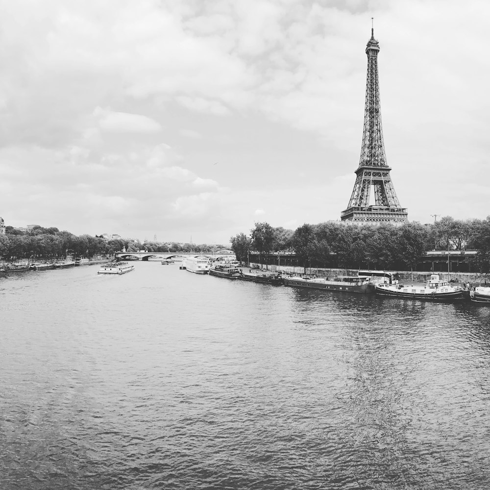 a large tower next to a body of water