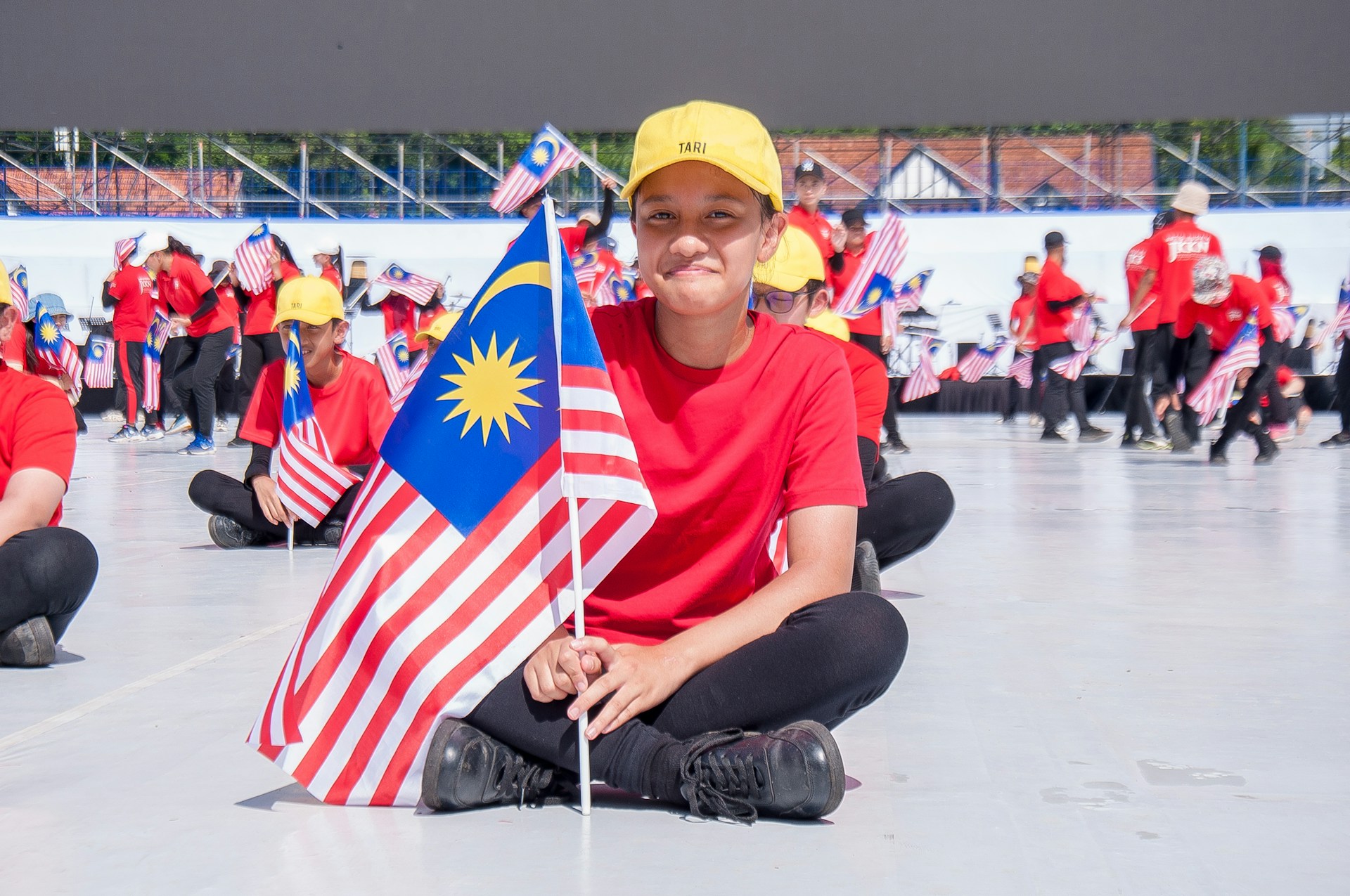 A vibrant rally supporting the 'Selamatkan Sabah' movement with Isnaraissah Munirah at the forefront.