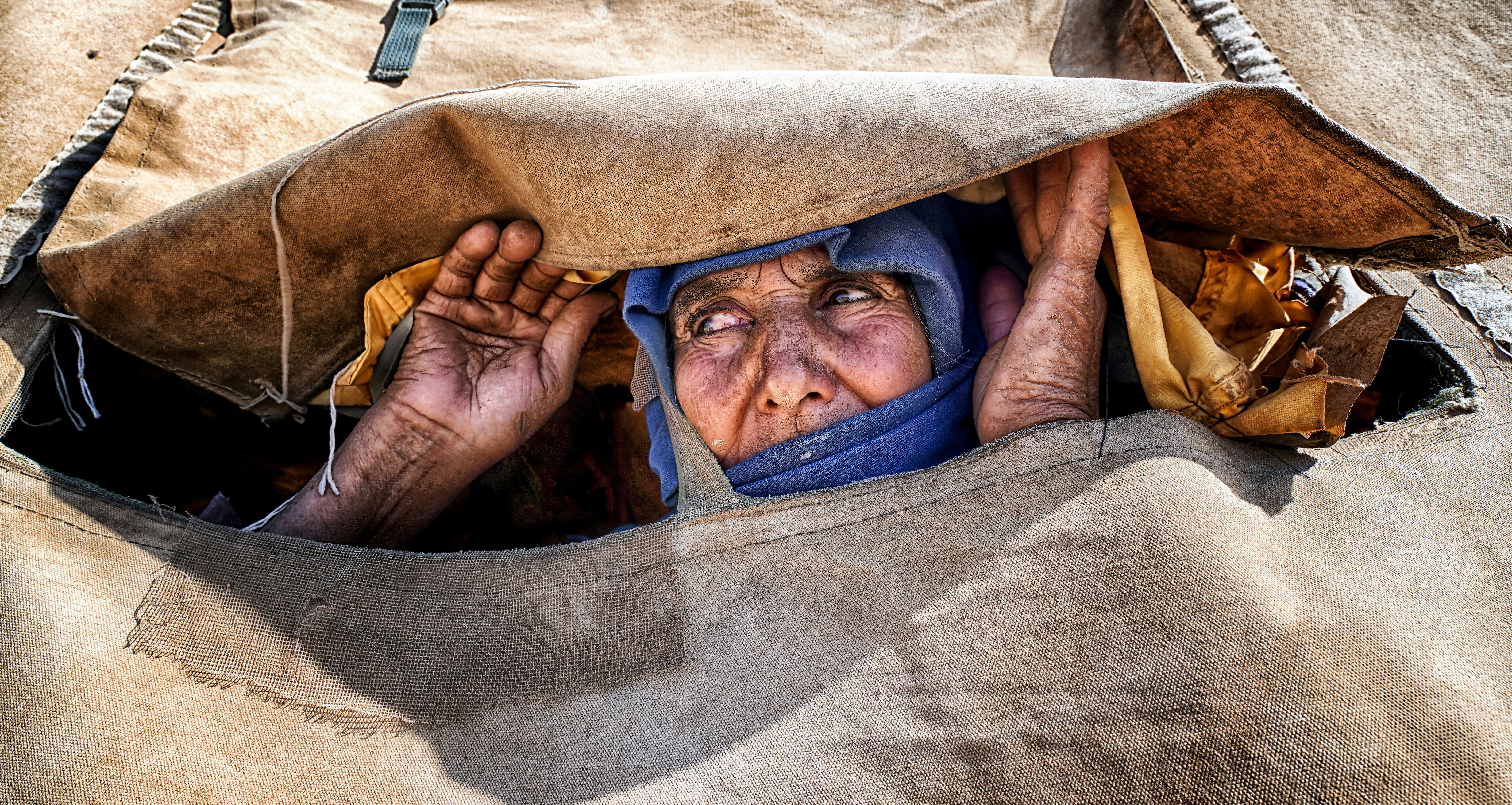 a person lying in a hammock