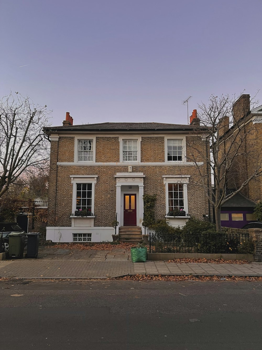 a brick building with a red door