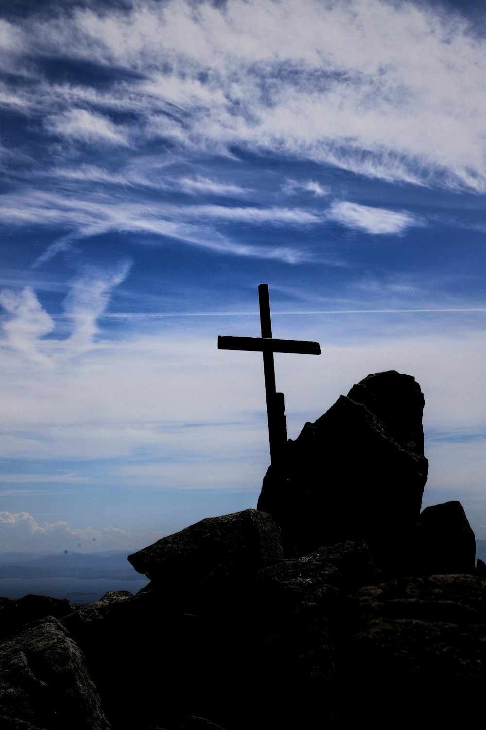 a cross on a mountain