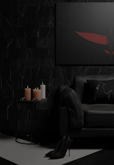 A moody, refined living room featuring warm black and taupe tones with minimalist furniture and architectural details.