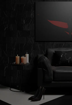 A sleek black and gold themed living room interior shot with cinematic lighting.
