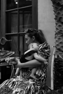 a person holding a baby