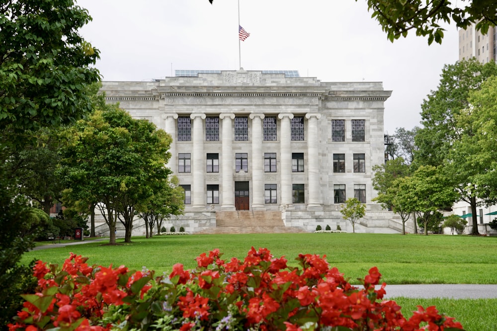 a large white building with a flag on top