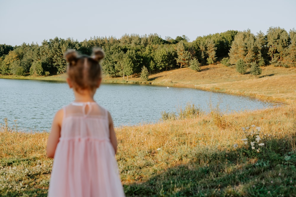 a person standing in front of a lake