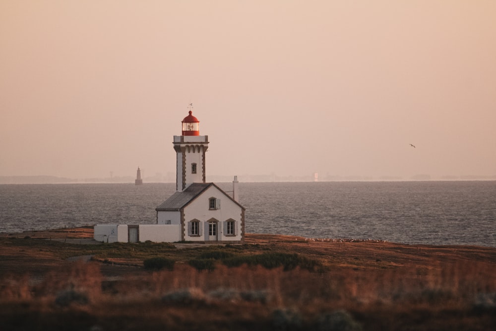 a white building by the water