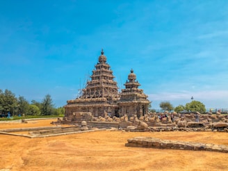 Photo of an old temple in Andhra Pradesh showing intricate stone carvings needing restoration.