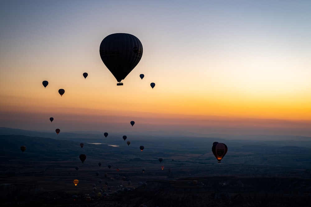 a group of hot air balloons in the sky