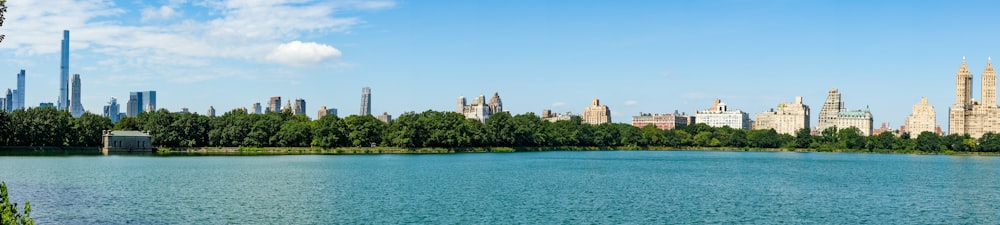 a body of water with a city in the background