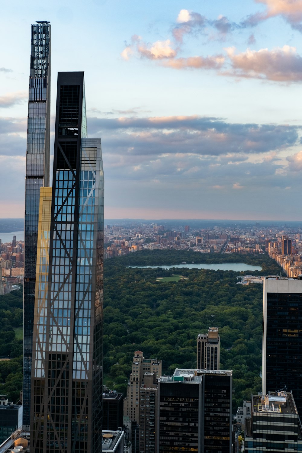 a tall building with a river in the background