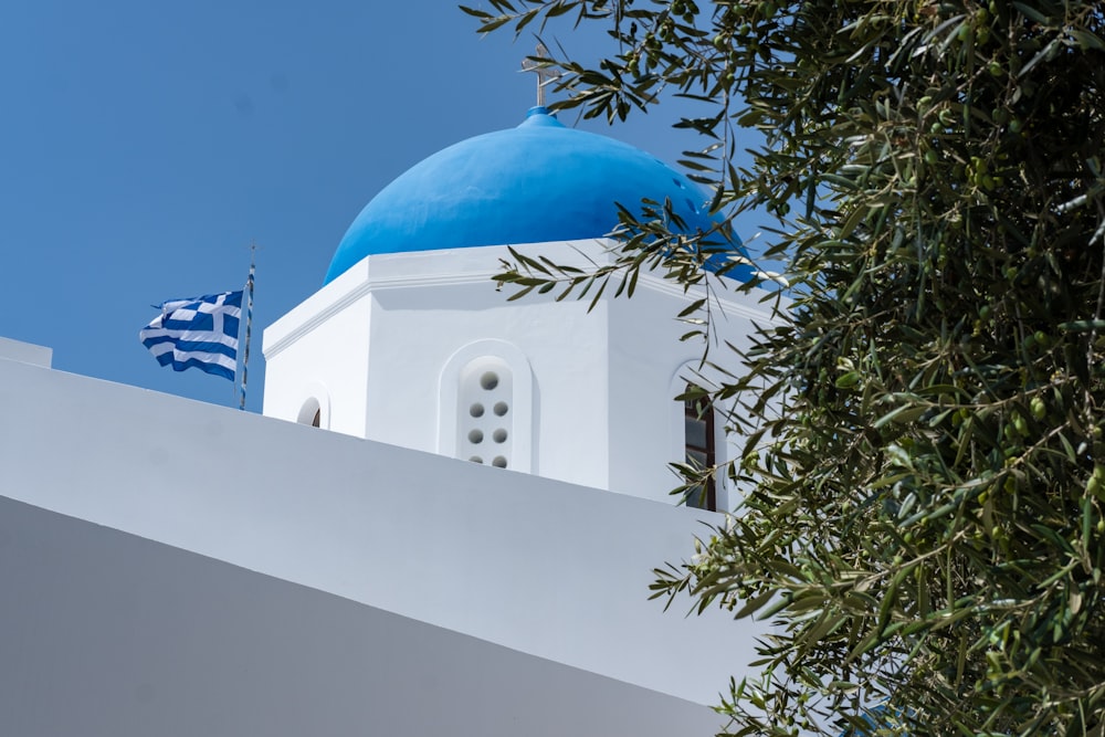 a white building with a blue dome