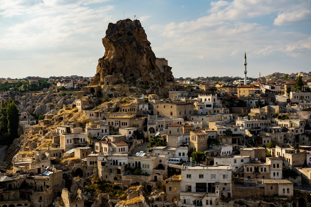 a city with a large rock on top of it