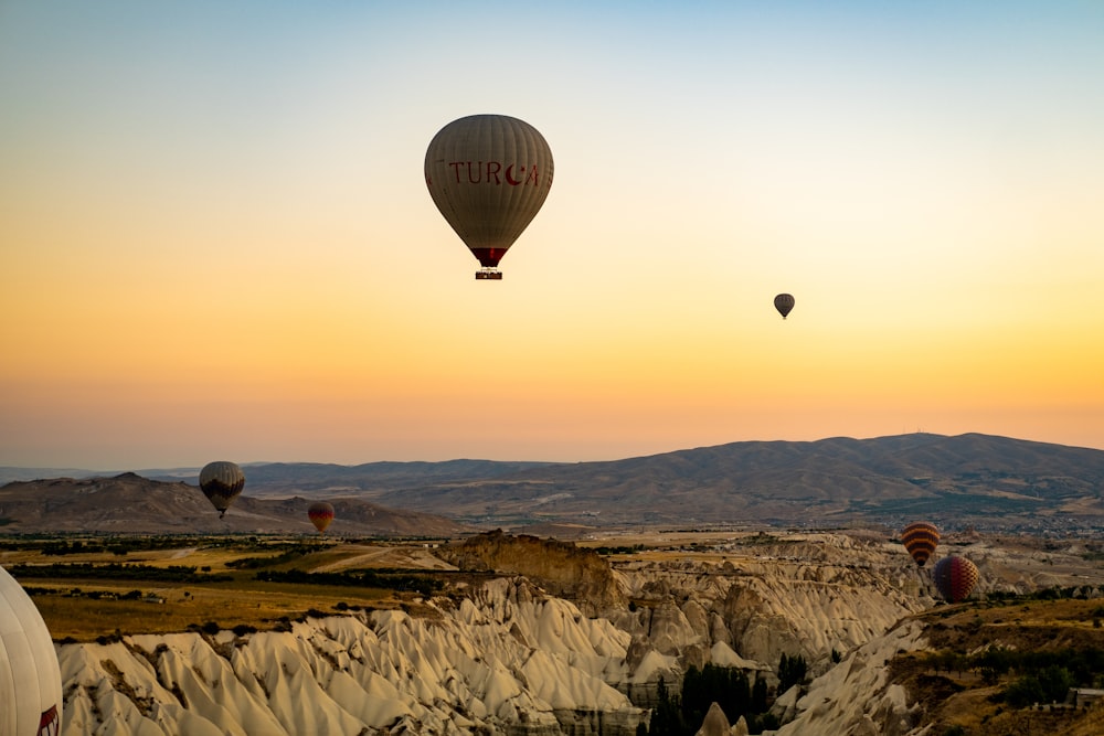 a group of hot air balloons in the sky