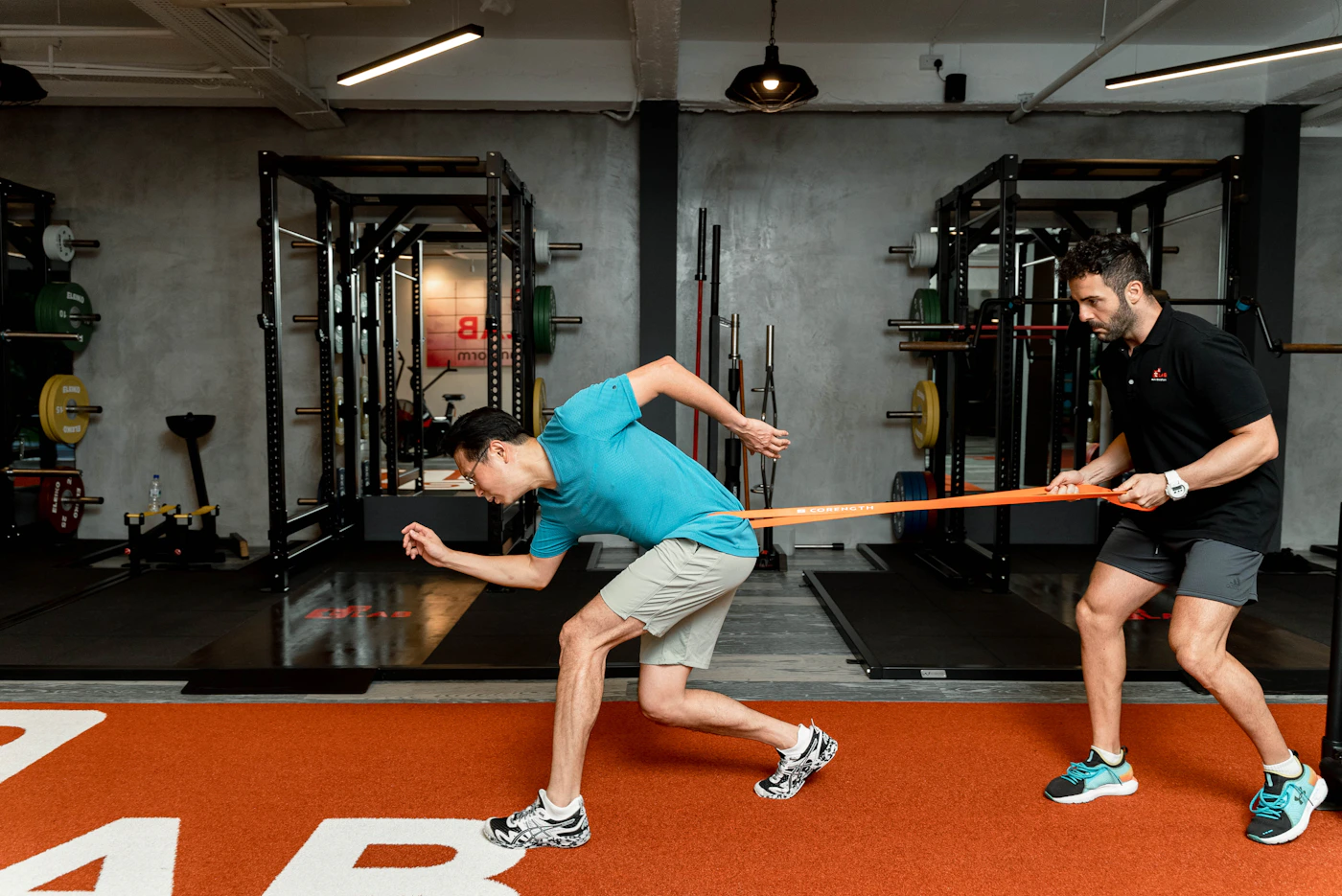 Athlete performing resistance band training with workout equipment