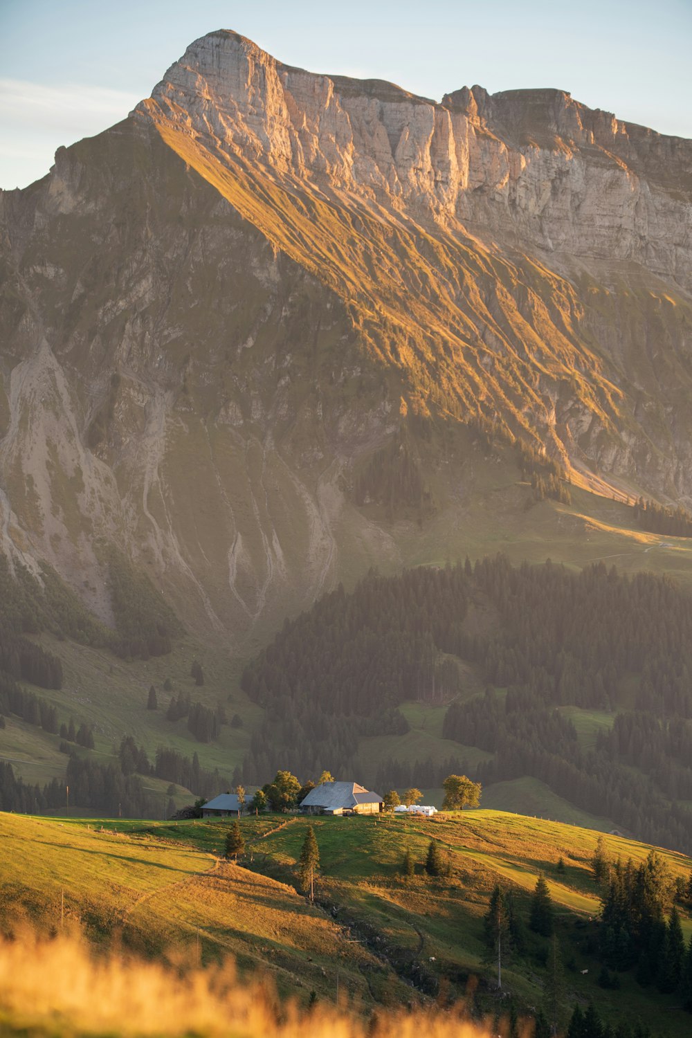 a house in front of a mountain