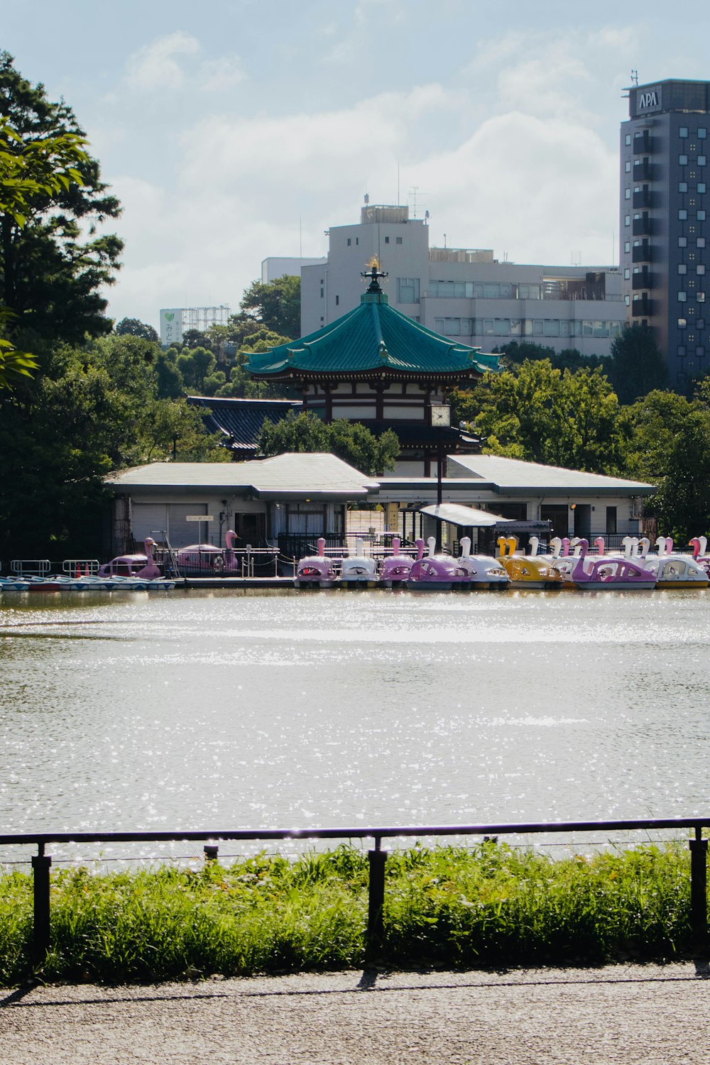 a body of water with boats and buildings in the background